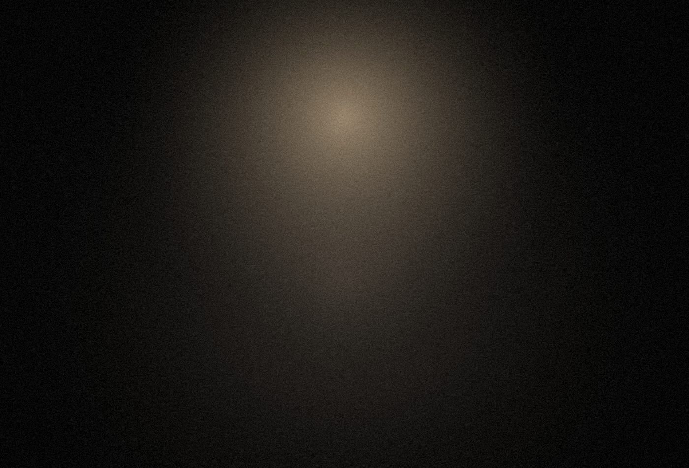 A figure silhouetted against slow smoke, back-lit